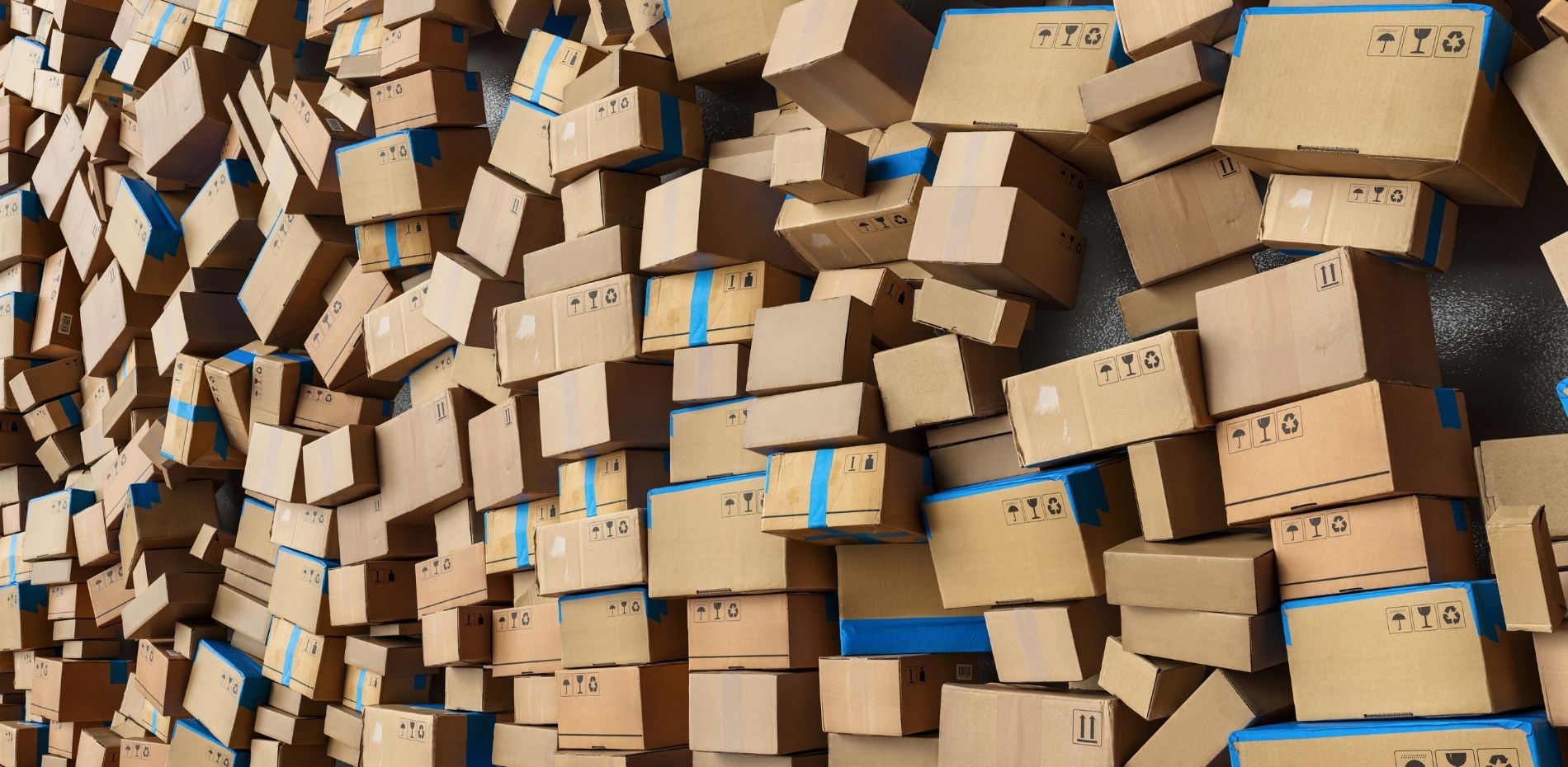 Many stacked cardboard shipping boxes in logistics warehouse before moving to delivery.