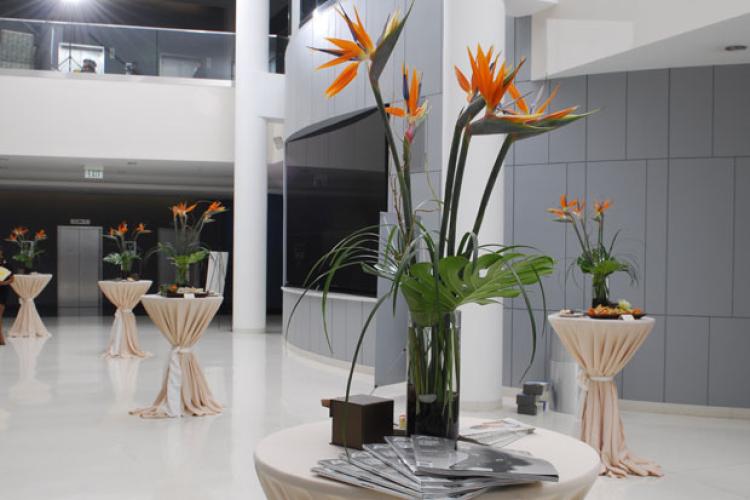 High top tables scattered around the Atrium with event decor