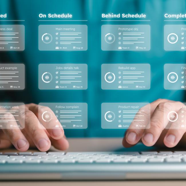 person typing on keyboard with a transparent project management dashboard overlayed on top of their chest and hands