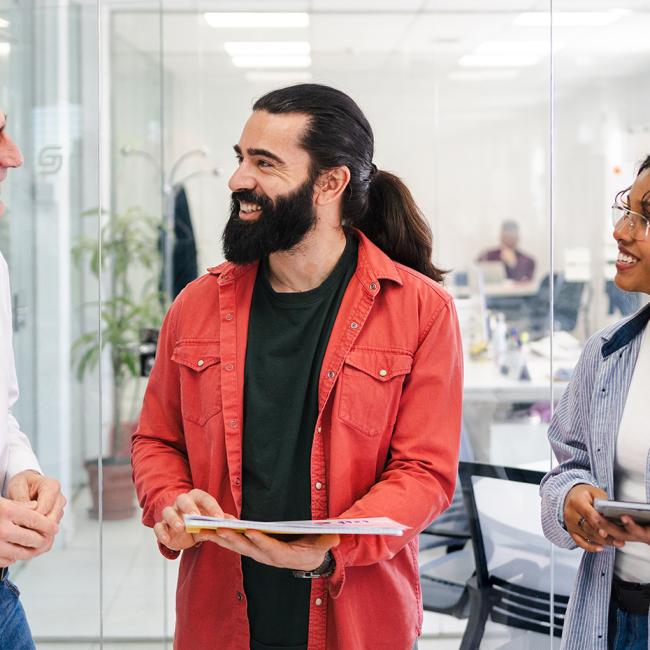 Coworkers speaking together at meeting