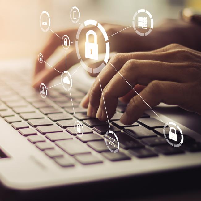 A person typing on a keyboard